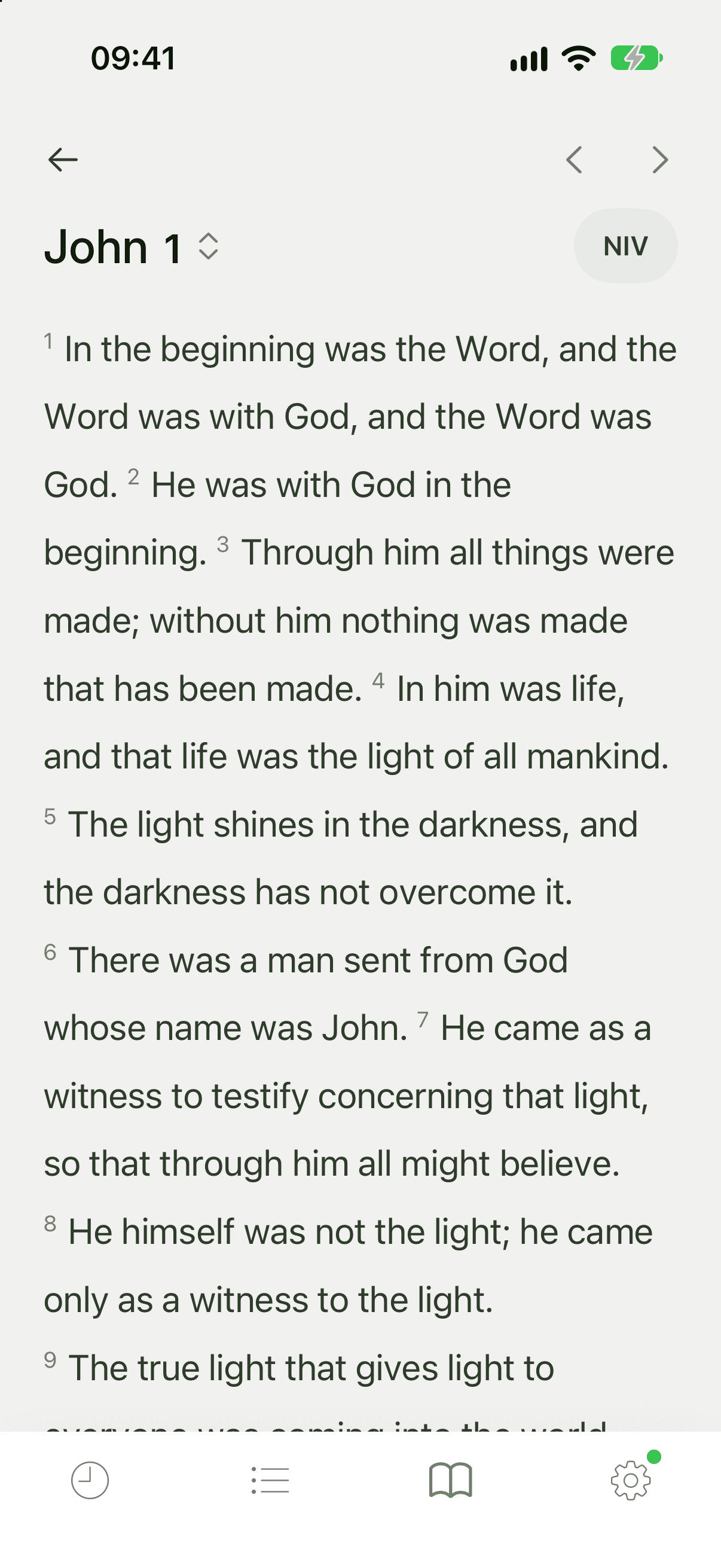 The Bible reader open at John 1 in NIV, with chapter arrows and a version chip